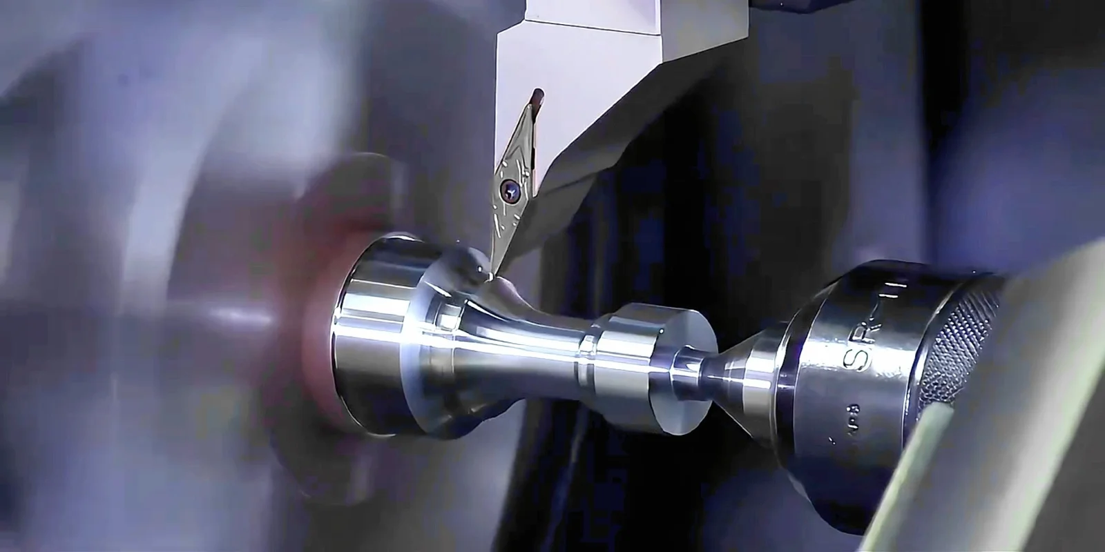 CNC turning metal part in process, showing precision lathe operations, multi-axis machining, and high-quality surface finishing.