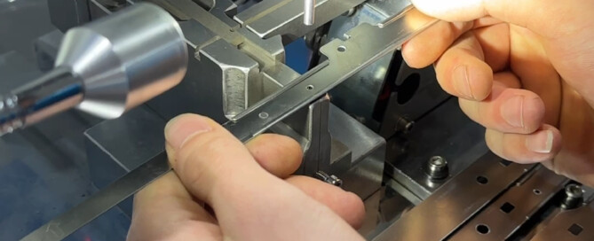 Precision sheet metal punching process producing accurate holes and shapes in metal components.