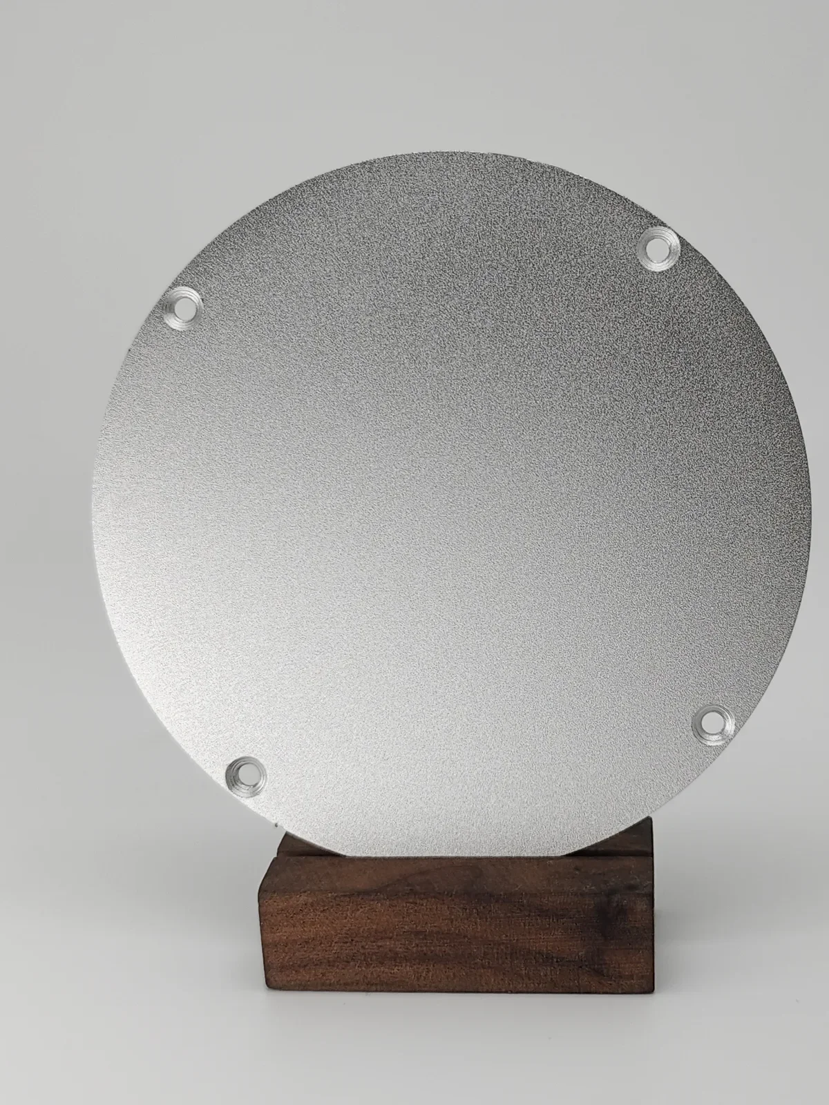 Sandblasted surface finish on metal part showing uniform matte texture and improved surface adhesion.