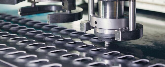 Sheet metal punching machine for precise holes and shapes in metal sheets for industrial fabrication.